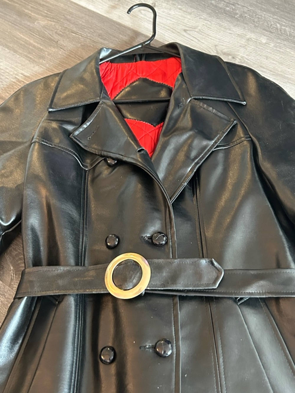 Faux Leather or Vegan Trench Coat with Red Lining and Gold Buckle on belt.